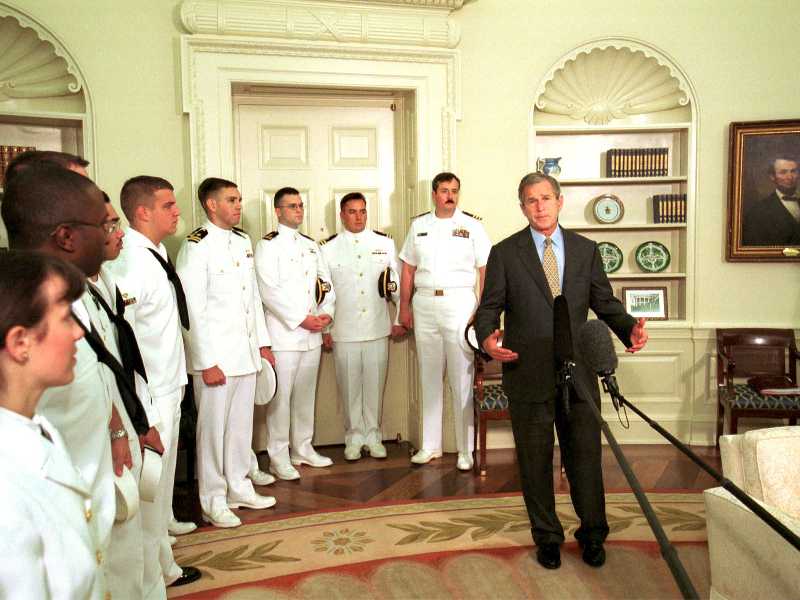President George W. Bush (R) giving speech in the Oval Office of the White House after greeting the crew of the Navy surveillance plane that was held on China's Hainan island.    (Photo by Mai/Getty Images)